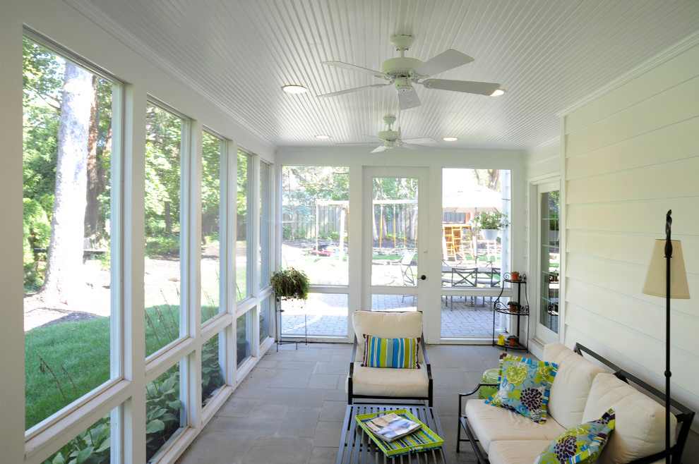 Photo of a classic veranda in Columbus with a roof extension and feature lighting.