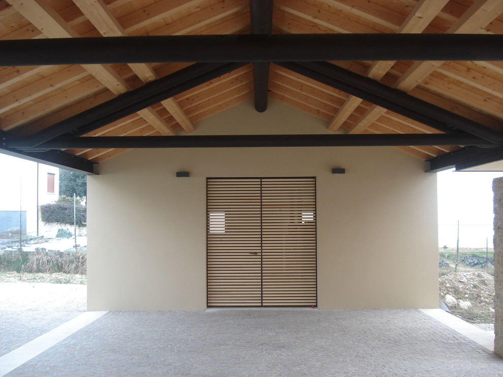 This is an example of a contemporary porch design in Venice.