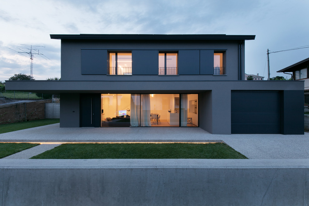 Idée de décoration pour un porche d'entrée de maison avant design de taille moyenne avec une extension de toiture.