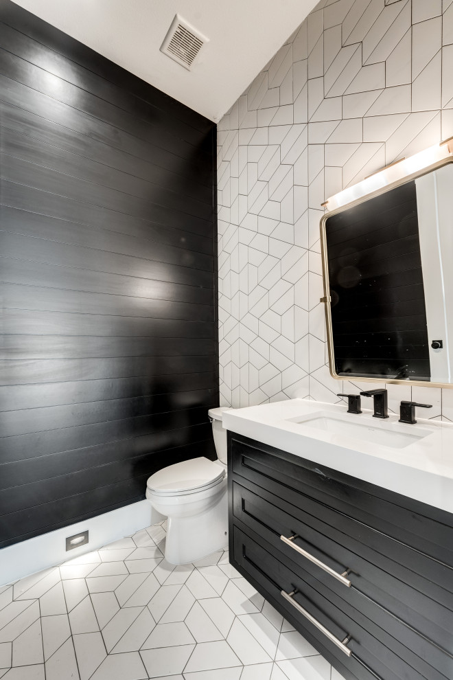 Example of an arts and crafts white tile and ceramic tile ceramic tile, white floor and shiplap wall powder room design in Dallas with recessed-panel cabinets, black cabinets, a one-piece toilet, black walls, an undermount sink, quartz countertops, white countertops and a floating vanity