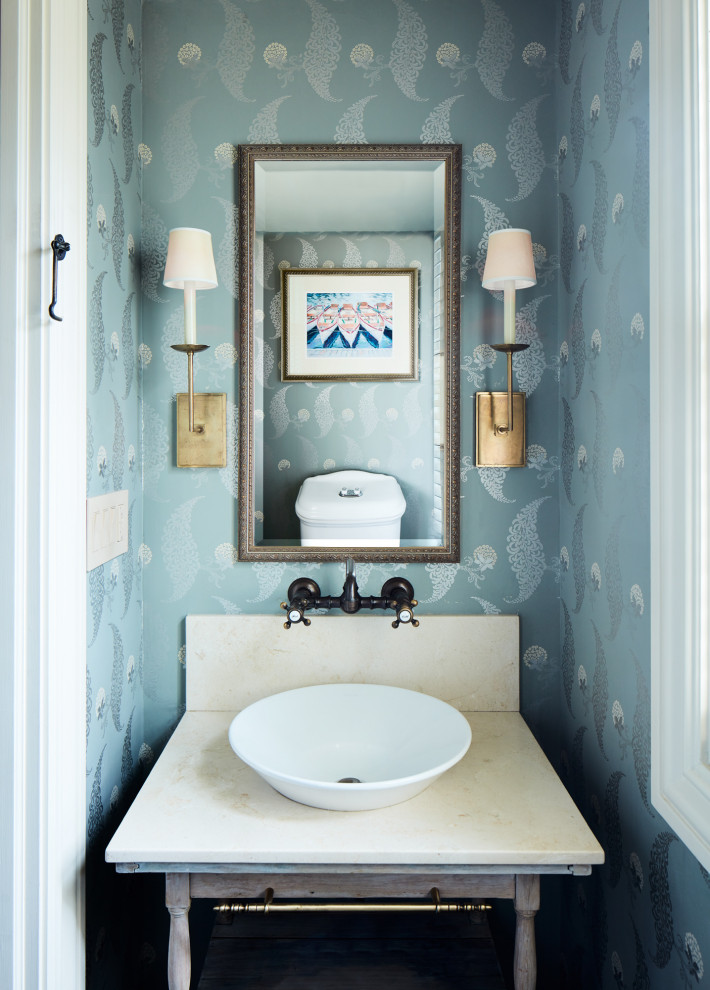 Cloakroom in New York with open cabinets, light wood cabinets, blue walls, a vessel sink, beige worktops, a freestanding vanity unit and wallpapered walls.