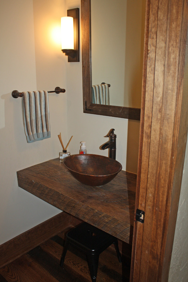 Inspiration for a rustic powder room remodel in Charlotte