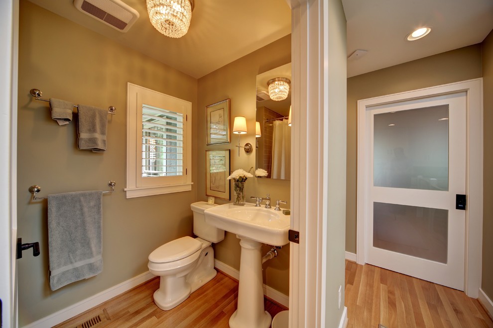 Design ideas for a medium sized eclectic cloakroom in Other with a two-piece toilet, beige walls and light hardwood flooring.