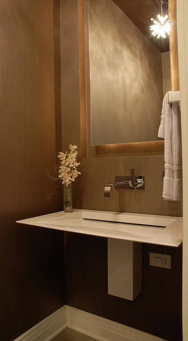Design ideas for a small contemporary cloakroom in Minneapolis with a wall mounted toilet, porcelain flooring, a wall-mounted sink and brown walls.