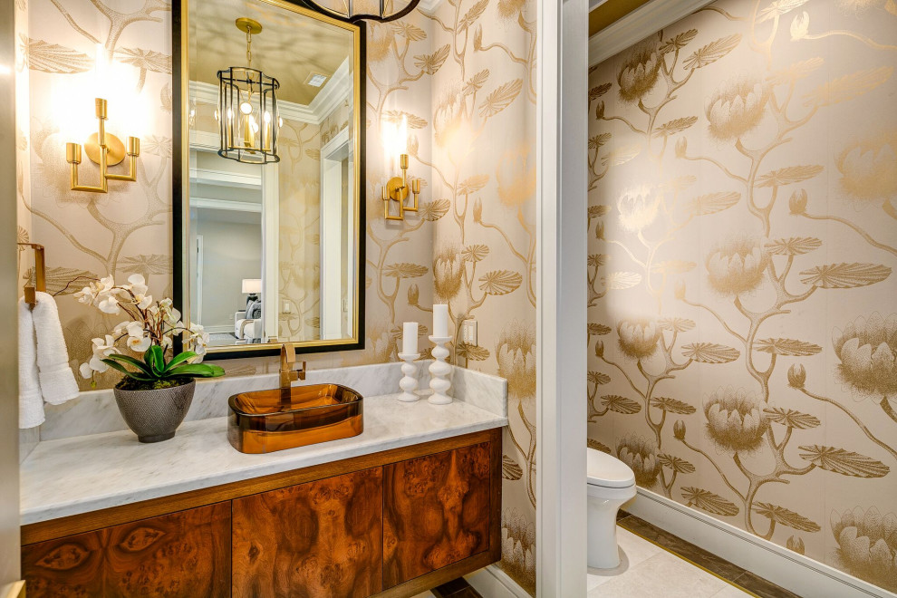 This is an example of a traditional cloakroom in Los Angeles with flat-panel cabinets, dark wood cabinets, beige walls, a vessel sink, beige floors, white worktops, a floating vanity unit and wallpapered walls.