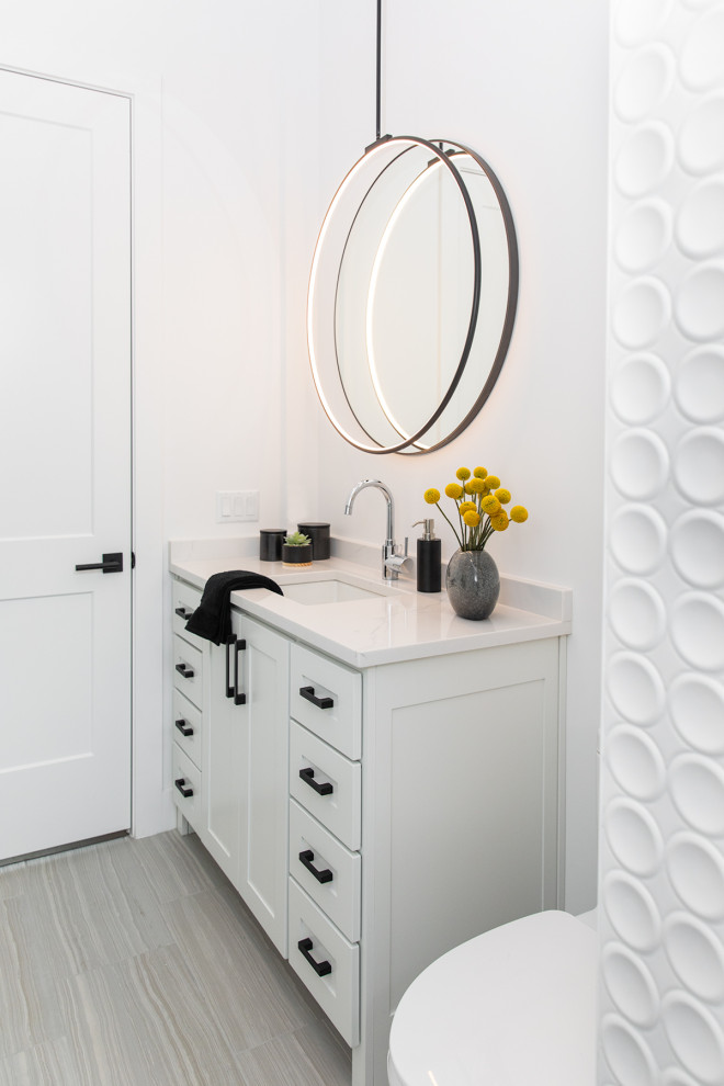 Transitional powder room photo in Austin