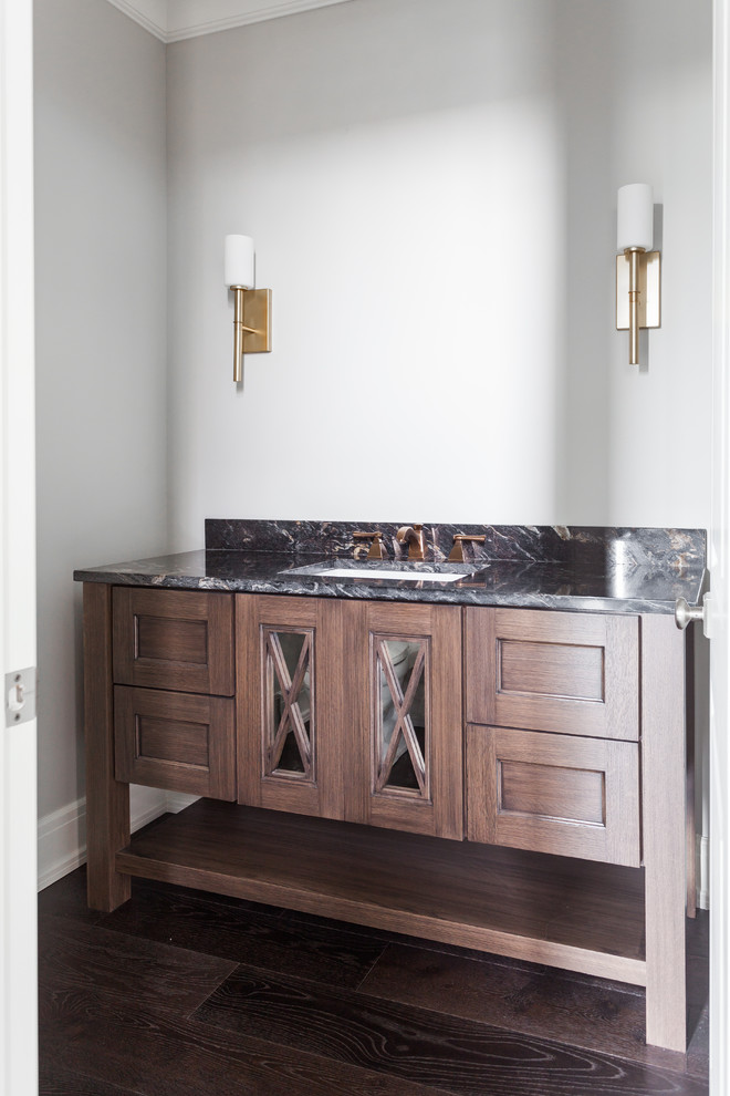 Design ideas for a medium sized traditional cloakroom in Detroit with shaker cabinets and brown cabinets.