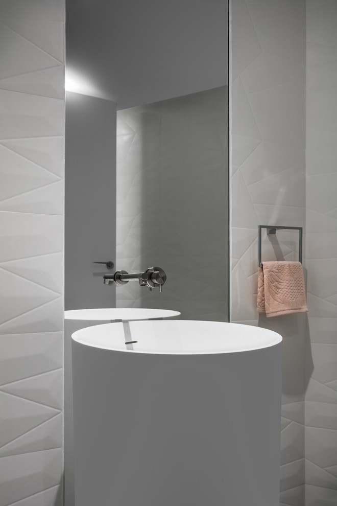 Photo of a modern cloakroom in Miami with a one-piece toilet, porcelain tiles, white walls, porcelain flooring, a pedestal sink, quartz worktops, grey floors and white worktops.