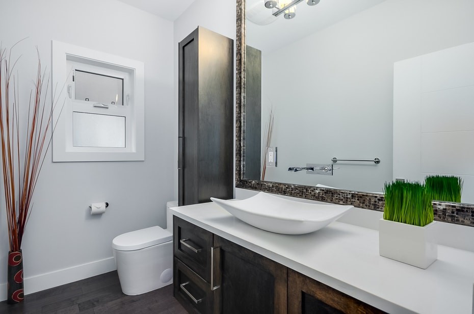 Example of a large trendy white tile and porcelain tile dark wood floor and brown floor powder room design in Vancouver with shaker cabinets, dark wood cabinets, gray walls, a vessel sink and quartz countertops