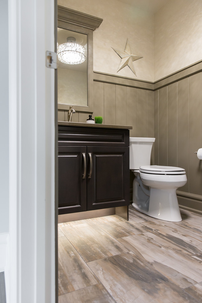 Design ideas for a small rural cloakroom in Edmonton with raised-panel cabinets, grey cabinets, a two-piece toilet, brown walls, porcelain flooring, a submerged sink, engineered stone worktops and multi-coloured floors.