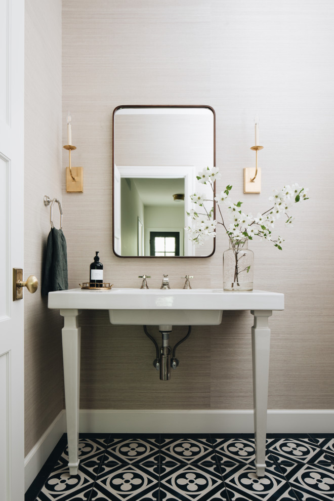 Inspiration for a classic cloakroom in Grand Rapids with beige walls, porcelain flooring, a wall-mounted sink, black floors, white worktops, a floating vanity unit and wallpapered walls.