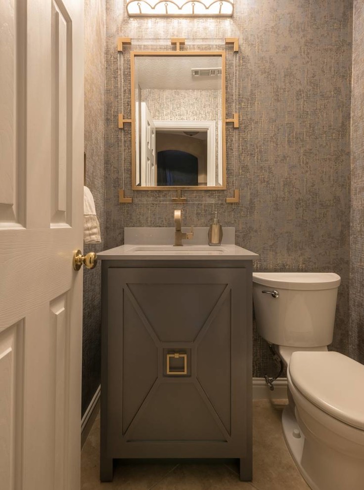 This is an example of a small modern cloakroom in Dallas with recessed-panel cabinets, grey cabinets, a one-piece toilet, a submerged sink, marble worktops, multi-coloured walls, porcelain flooring and grey floors.