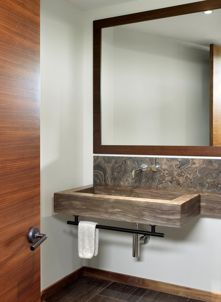 Inspiration for a medium sized contemporary cloakroom in Toronto with a trough sink, limestone worktops, stone slabs, white walls, limestone flooring and brown worktops.