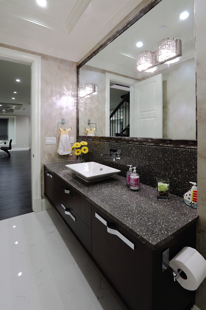 Design ideas for a small contemporary cloakroom in Vancouver with a vessel sink, flat-panel cabinets, dark wood cabinets, engineered stone worktops, white tiles, stone slabs, grey walls and porcelain flooring.