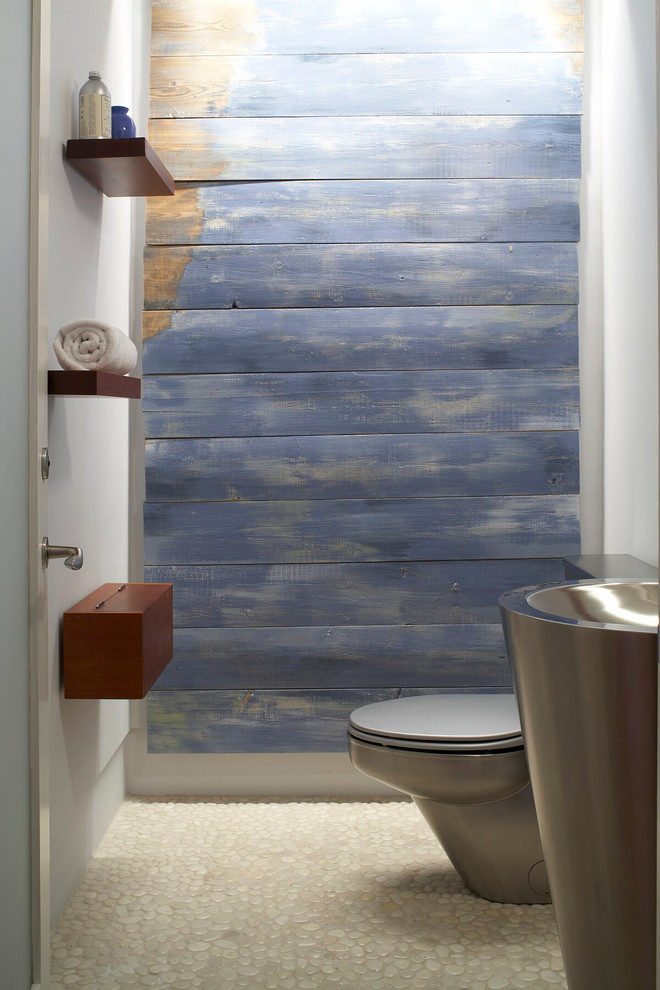 Beach style powder room photo in Providence with blue walls