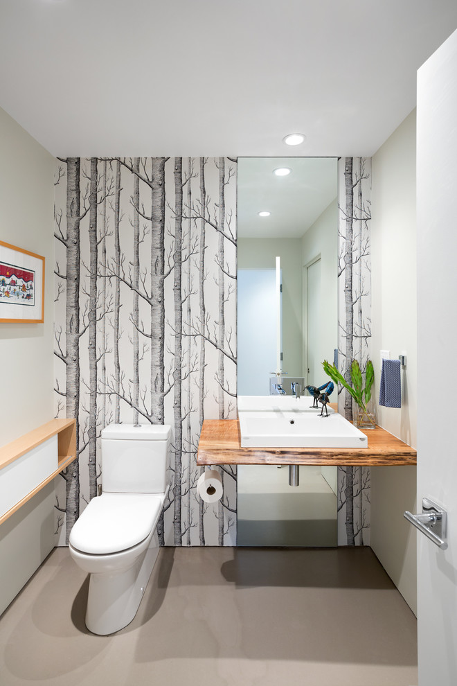 Photo of a contemporary cloakroom in Vancouver with beige floors.