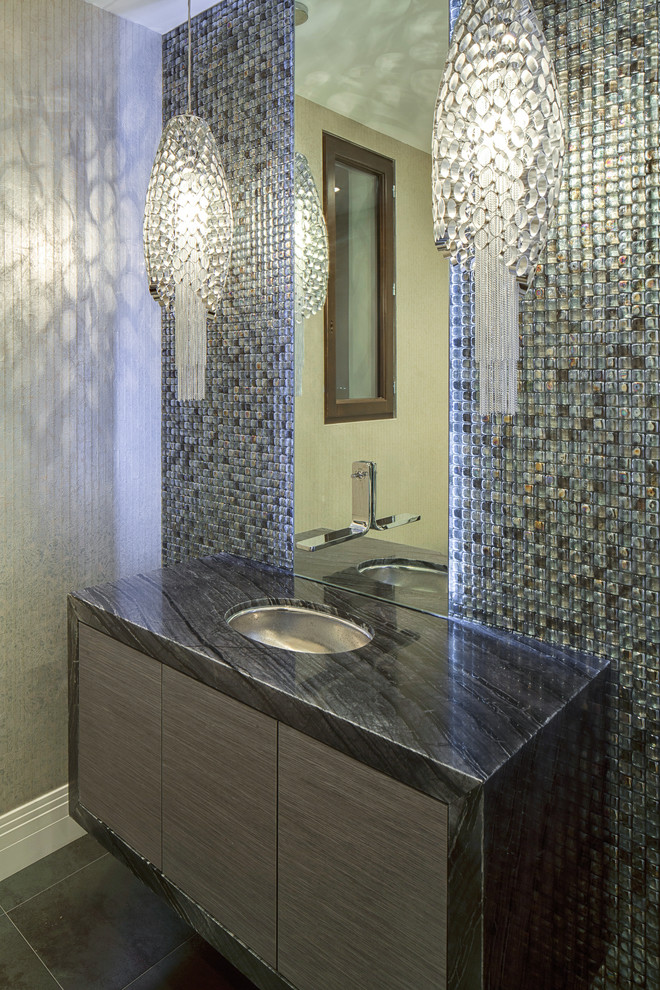Powder room - mid-sized contemporary mosaic tile and gray tile ceramic tile powder room idea in Los Angeles with flat-panel cabinets, beige walls, dark wood cabinets and an undermount sink