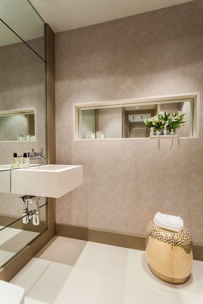 Inspiration for a contemporary cloakroom in Miami with a wall-mounted sink.