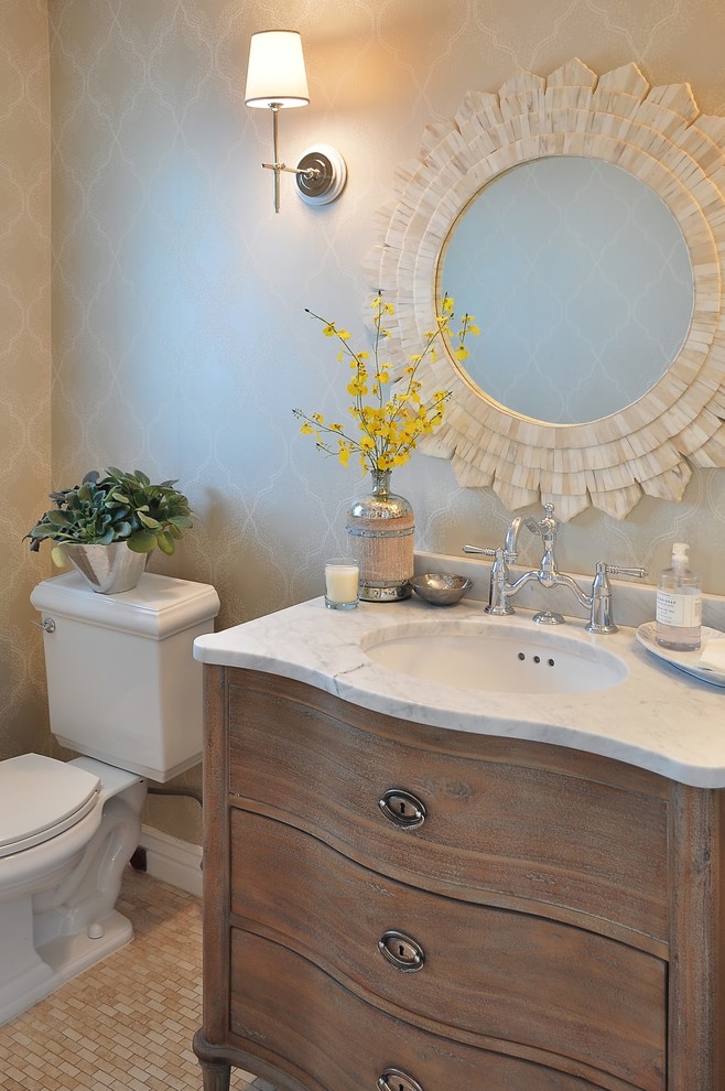 Example of a french country powder room design in Phoenix with an undermount sink, a two-piece toilet, furniture-like cabinets and dark wood cabinets