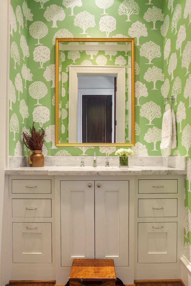 Elegant powder room photo in Houston with beaded inset cabinets, white cabinets, marble countertops and green walls