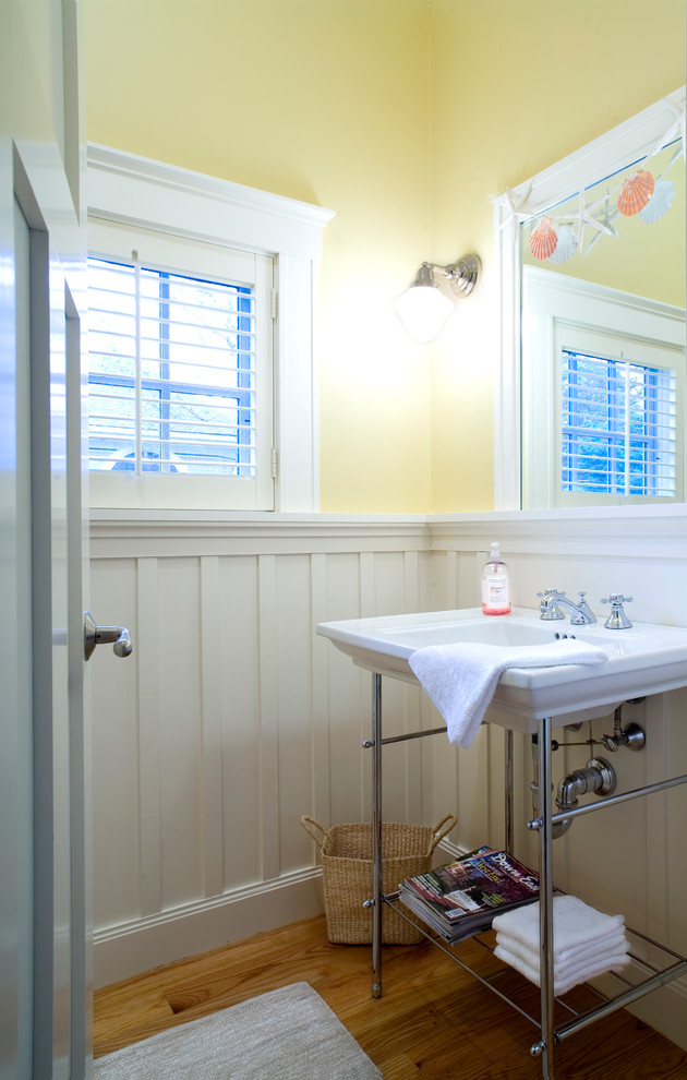Arts and crafts powder room photo in Boston with a console sink
