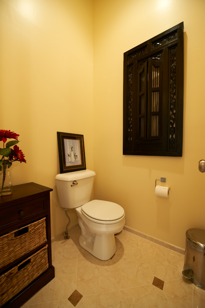 Medium sized classic cloakroom in DC Metro with open cabinets, dark wood cabinets, a two-piece toilet, yellow walls, limestone flooring and wooden worktops.