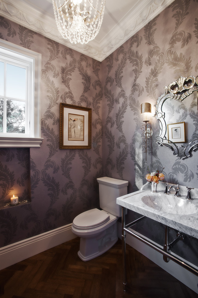 Inspiration for a timeless dark wood floor powder room remodel in San Francisco with a console sink, a two-piece toilet and gray walls