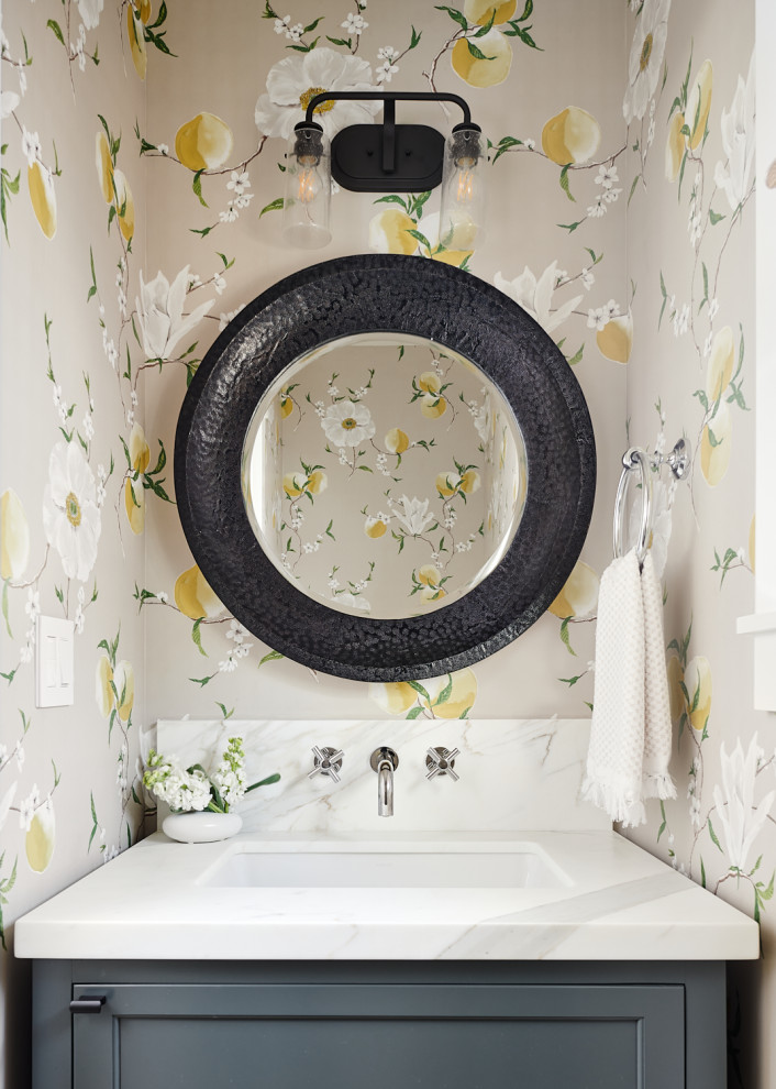 Transitional wallpaper powder room photo in San Francisco with recessed-panel cabinets, gray cabinets, multicolored walls, an undermount sink, white countertops and a built-in vanity