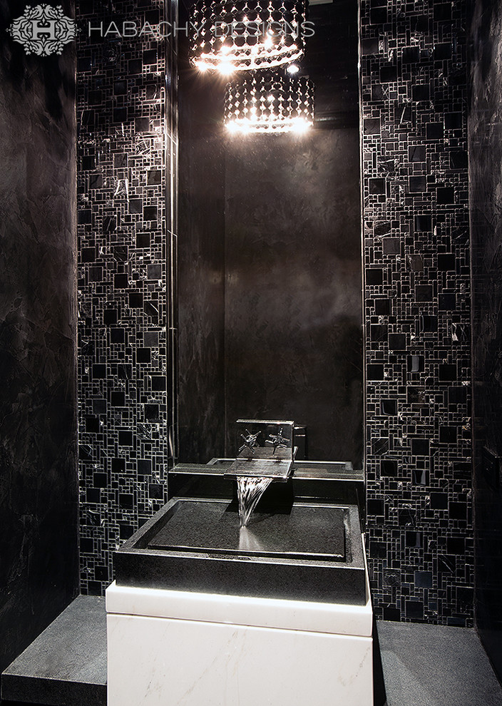 Exemple d'un petit WC et toilettes moderne avec une vasque, un plan de toilette en marbre, un carrelage noir, un mur noir et un sol en marbre.