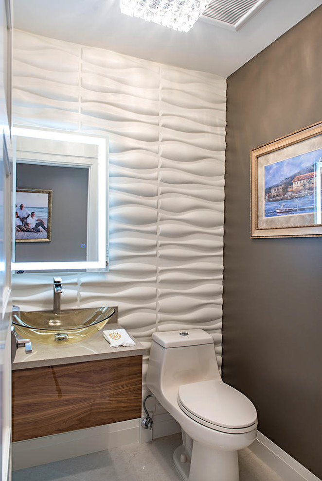 Small modern cloakroom in Tampa with flat-panel cabinets, medium wood cabinets, a one-piece toilet, white tiles, white walls, porcelain flooring, a vessel sink, engineered stone worktops and white floors.