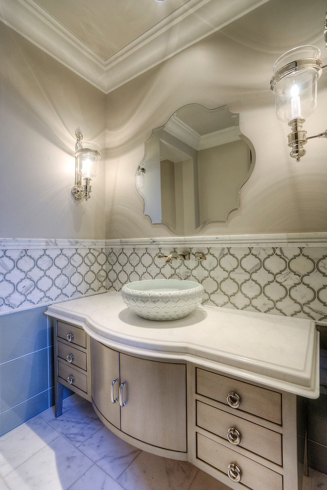 Example of a huge cottage chic multicolored tile and marble tile marble floor and white floor powder room design in Phoenix with flat-panel cabinets, brown cabinets, a one-piece toilet, beige walls, a vessel sink, quartzite countertops and multicolored countertops