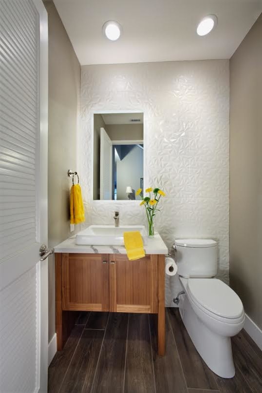 Design ideas for a small classic cloakroom in Sacramento with shaker cabinets, medium wood cabinets, a two-piece toilet, white tiles, a vessel sink, brown floors, white worktops, porcelain tiles, white walls, porcelain flooring and engineered stone worktops.