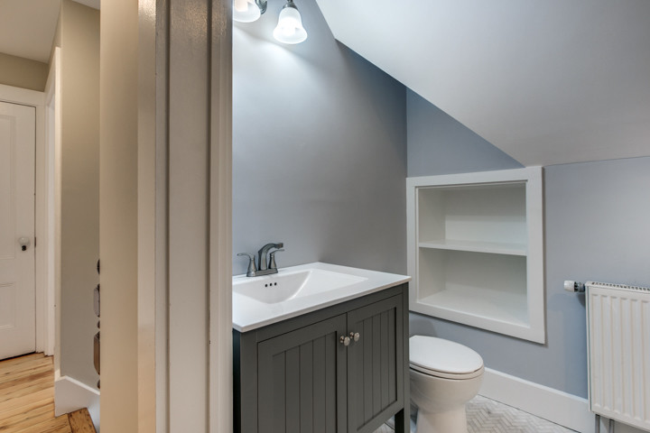 Small ornate powder room photo in Boston with blue walls