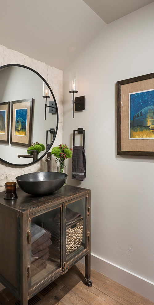 Mountain style light wood floor powder room photo in Other with furniture-like cabinets, white walls and a vessel sink