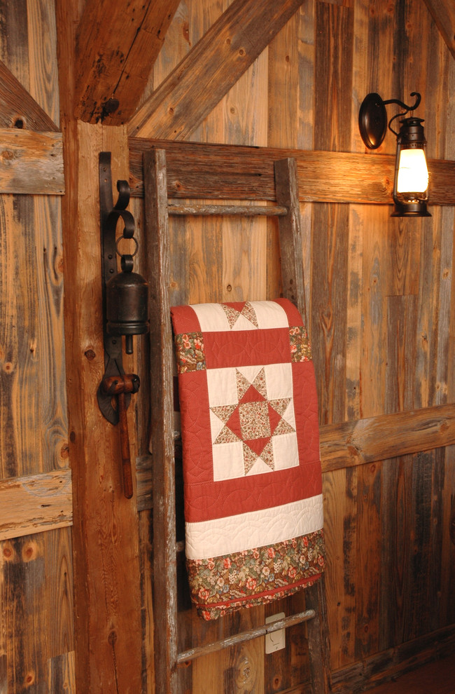 This is an example of a medium sized rustic cloakroom in Cincinnati with medium hardwood flooring.