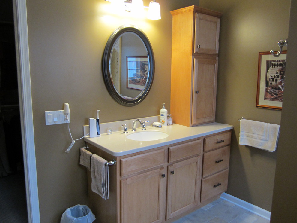 Photo of a medium sized traditional cloakroom in Cleveland with a submerged sink, flat-panel cabinets, a two-piece toilet, beige walls and ceramic flooring.