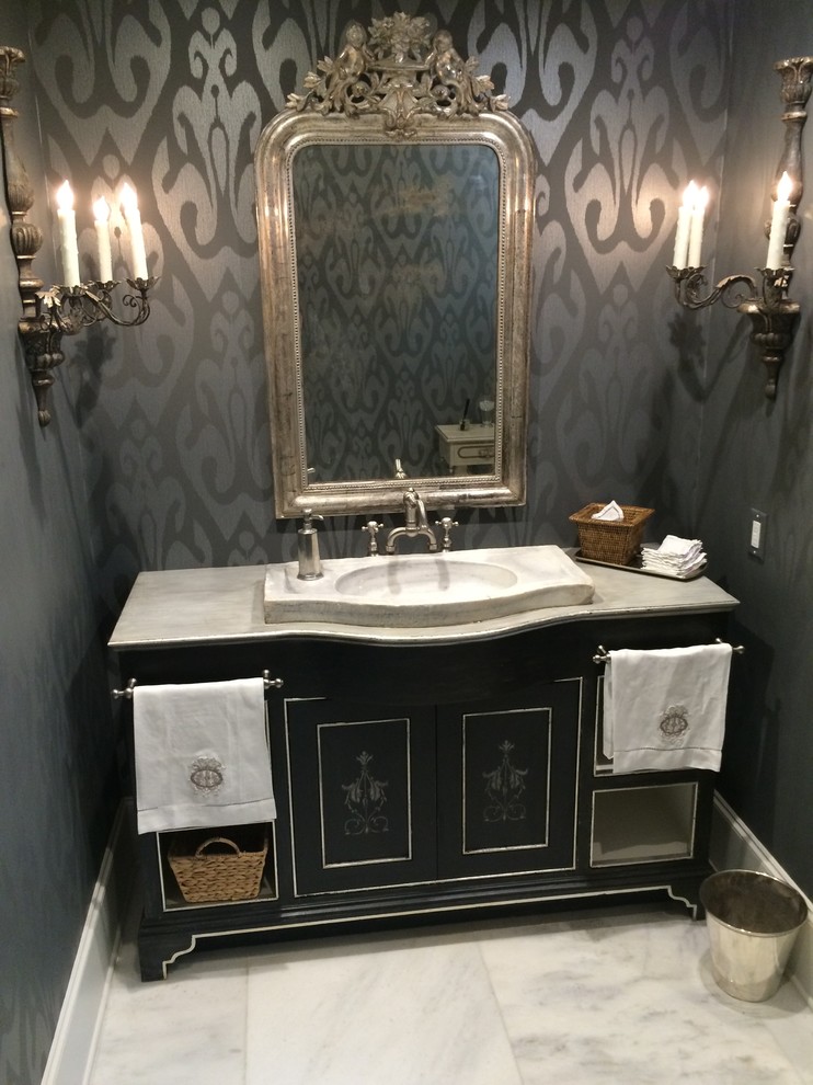 Example of a mid-sized classic white tile marble floor powder room design in Houston with an integrated sink, flat-panel cabinets, black cabinets, marble countertops and multicolored walls