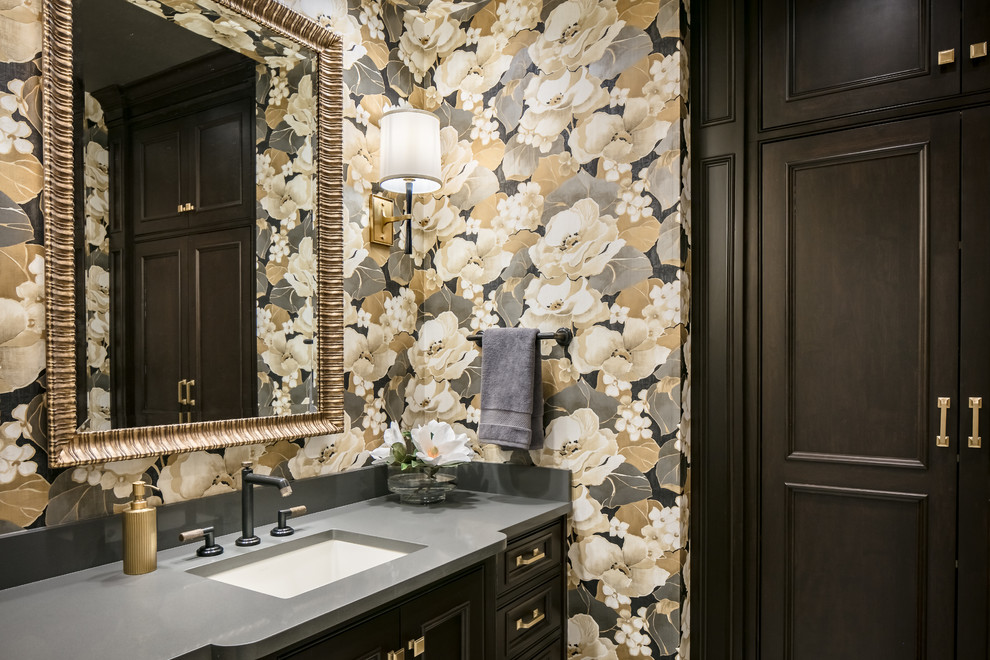 Powder room - mid-sized transitional medium tone wood floor powder room idea in Kansas City with beaded inset cabinets, dark wood cabinets, multicolored walls, an undermount sink, quartz countertops and gray countertops