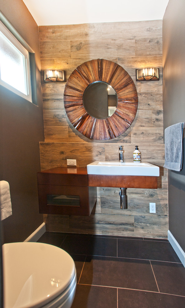 This is an example of a small contemporary cloakroom in San Francisco with dark wood cabinets, brown walls, slate flooring, wooden worktops, open cabinets and a built-in sink.