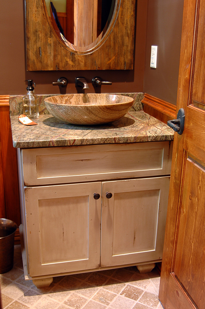 This is an example of a small rustic cloakroom in Portland Maine with freestanding cabinets, distressed cabinets, beige walls, slate flooring, a submerged sink and granite worktops.
