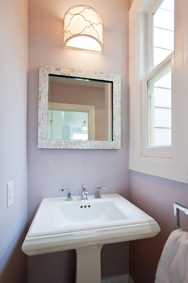 Example of a beach style powder room design in San Francisco with a pedestal sink