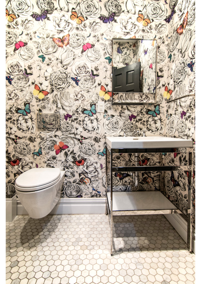 Inspiration for a mid-sized transitional powder room remodel with open cabinets, a wall-mount toilet, an integrated sink, solid surface countertops and white countertops