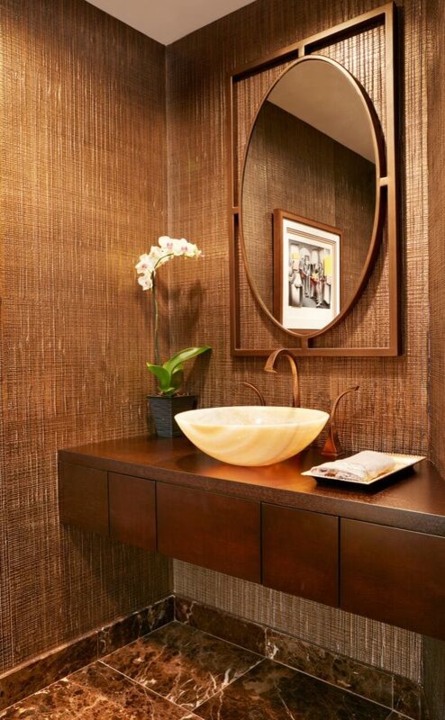 Photo of a small contemporary cloakroom in Miami with flat-panel cabinets, medium wood cabinets, a one-piece toilet, brown tiles, brown walls, marble flooring, a vessel sink, wooden worktops and brown worktops.