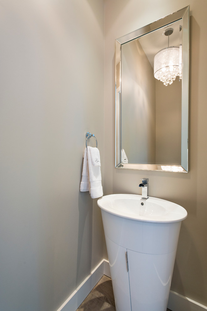 This is an example of a small traditional cloakroom in Vancouver with a pedestal sink, grey walls and porcelain flooring.