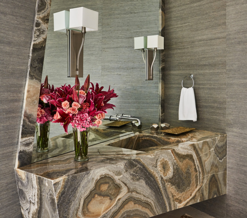 Example of a small trendy powder room design in Los Angeles with gray walls, an integrated sink and granite countertops