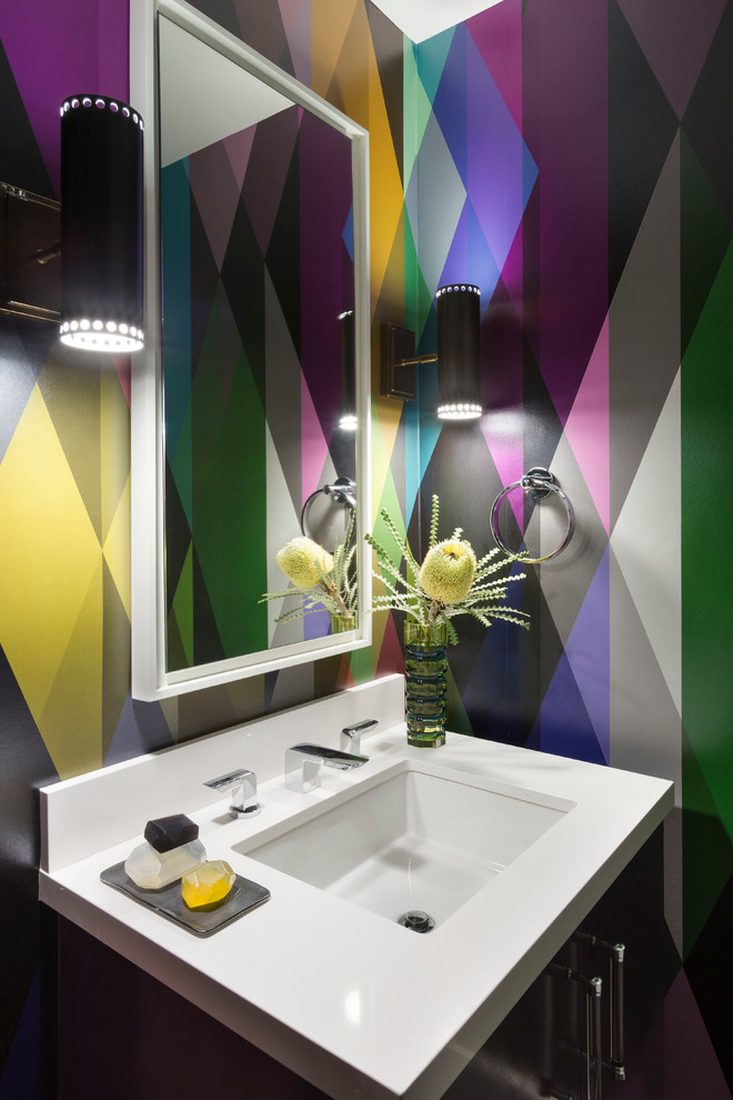 Small trendy powder room photo in San Francisco with multicolored walls, an undermount sink and white countertops