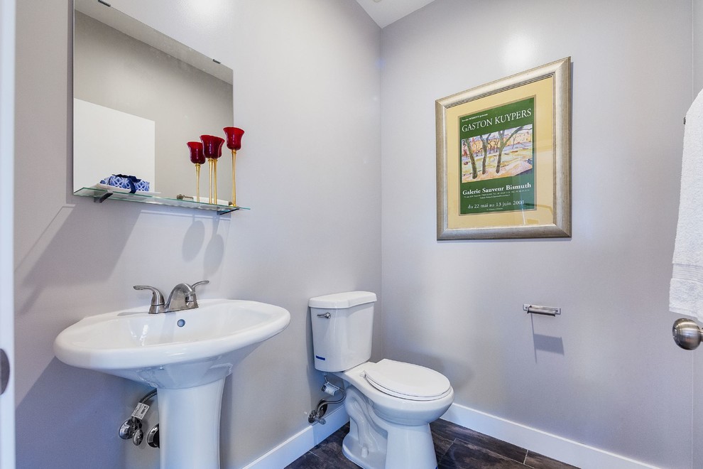 Photo of a small contemporary cloakroom in Los Angeles with a pedestal sink, grey walls and slate flooring.