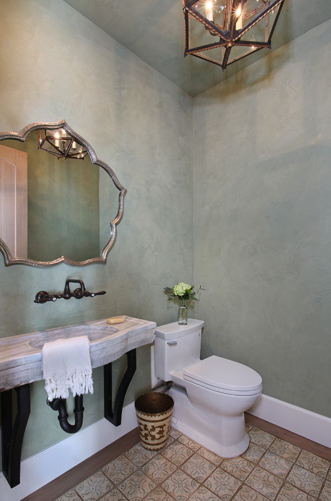 Example of a tuscan powder room design in Orange County