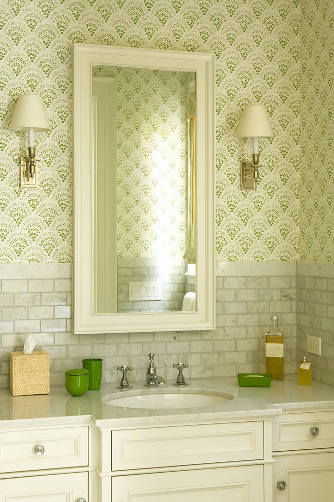 Elegant gray tile and marble tile powder room photo in Los Angeles with recessed-panel cabinets and white cabinets