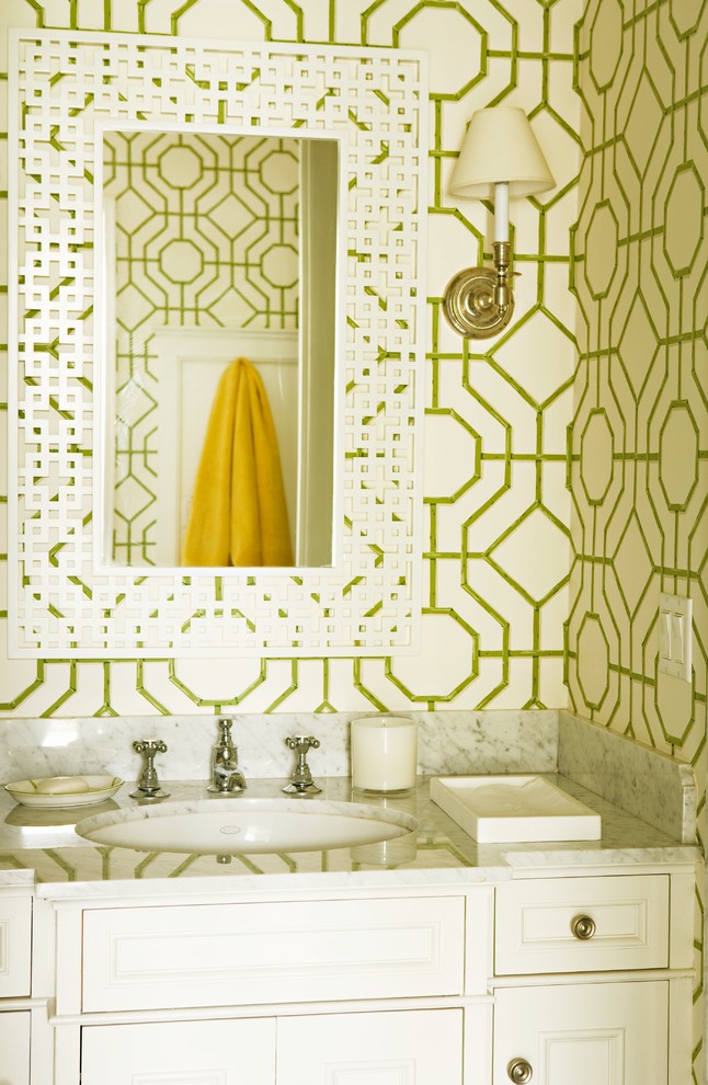 Powder room - traditional powder room idea in Los Angeles with marble countertops